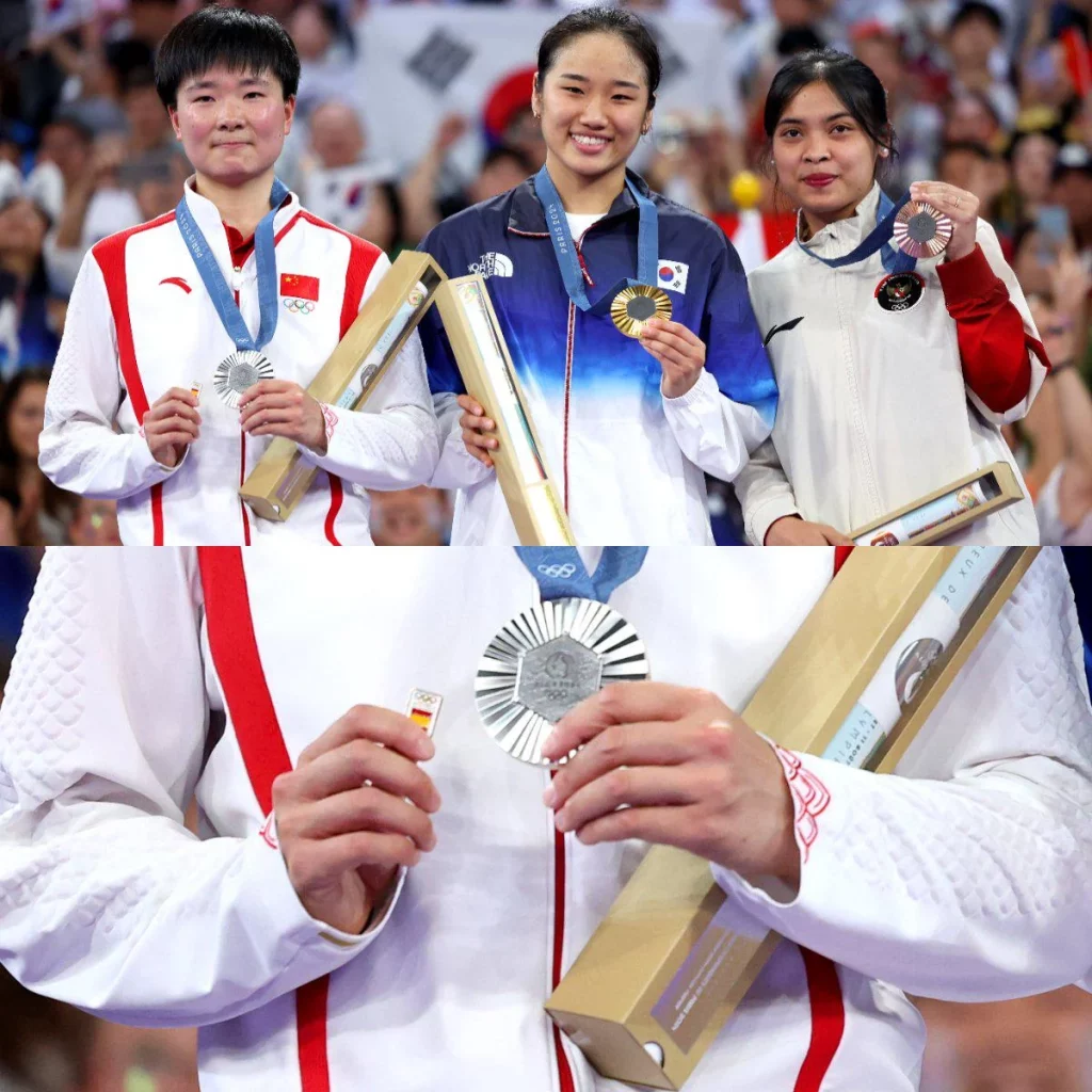 chinese shuttler he bingjiao carries spanish flag badge v0 dvzub9up9ugd1